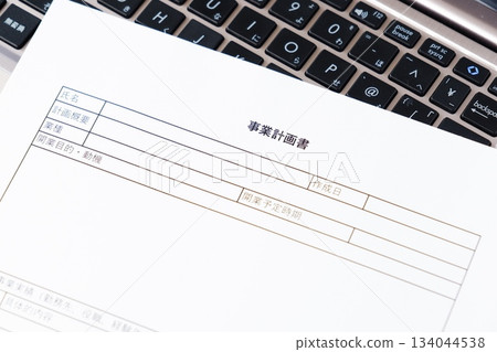Business Plan - Image of an entrepreneur creating a business plan prior to launching a new business Business Plan - Image of an entrepreneur creating a business plan prior to launching a new business 134044538