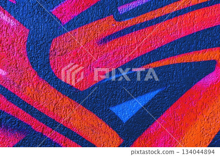 Vibrant Graffiti Art in Bright Orange, Blue, Red with 90s Urban Style Texture 134044894