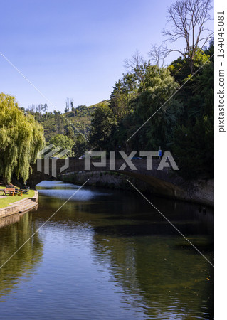 Esch-sur-Sure, Wiltz, Grand-Duche de Luxembourg, September 07, 2025, Peaceful pathway beside curved 134045081