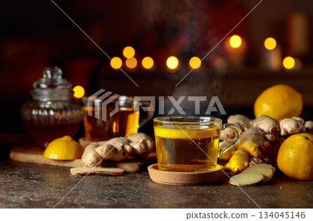 Cup of ginger tea with lemon, honey, mint, and ginger root. Cup of ginger tea with lemon, honey, mint, and ginger root. 134045146