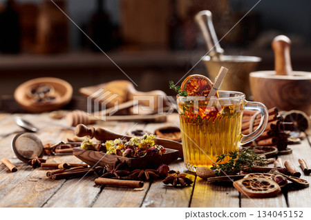 Herbal tea with thyme and dried orange slice. Herbal tea with thyme and dried orange slice. 134045152