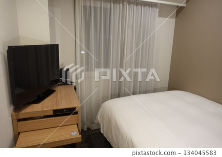 Hotel room with a single bed Hotel room with a single bed 134045583