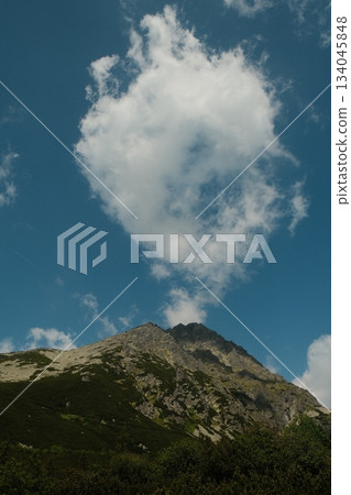 Dramatic Rocky Cliff And Bright Blue Sky 134045848