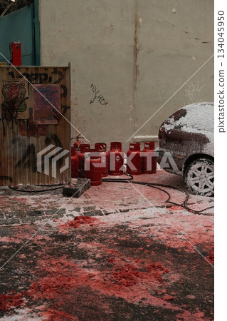 Rustic Red Tractor Beside Weathered Wall 134045950