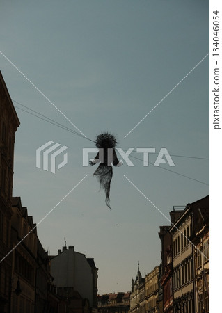 Dark Sculpture Against City Skyline Above 134046054