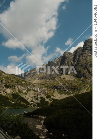 Dramatic Mountain Peaks Reflecting Azure Sky Dramatic Mountain Peaks Reflecting Azure Sky 134046063
