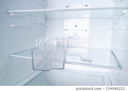 a broken plastic shelf from the door of a home refrigerator 134046222