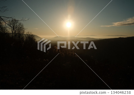 Golden Sunrise Over Misty Mountain Landscape Golden Sunrise Over Misty Mountain Landscape 134046238