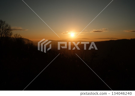 Golden Hour Landscape Over Distant Hills 134046240