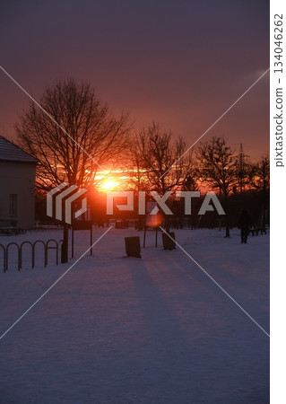 Electric Towers Silhouette Against Fiery Sunset 134046262