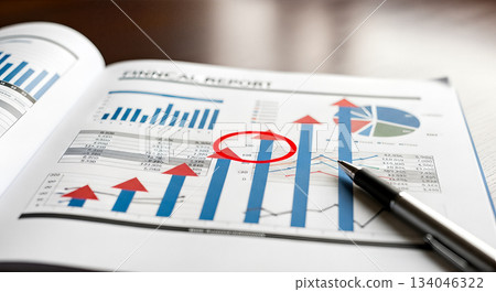 Financial report document with graphs and pen on table close up concept business analysis statistics growth profit planning strategy Financial report document with graphs and pen on table close up concept business analysis statistics growth profit planning strategy 134046322