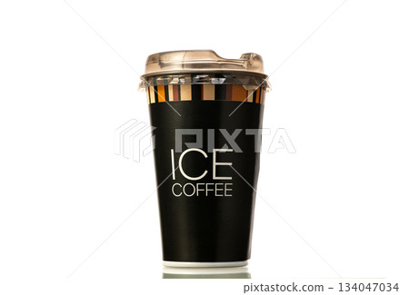 A black cup with a white lid and the word Ice Coffee written on it A black cup with a white lid and the word Ice Coffee written on it 134047034