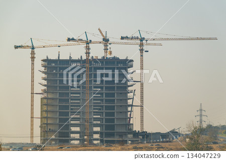 Yerevan Armenia 10.25.2025. A large building under construction with cranes in the background Yerevan Armenia 10.25.2025. A large building under construction with cranes in the background 134047229