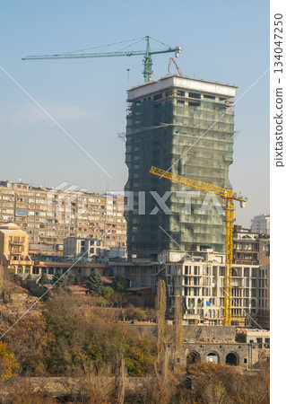 Yerevan Armenia 10.25.2025. A tall building with scaffolding on top of it Yerevan Armenia 10.25.2025. A tall building with scaffolding on top of it 134047250