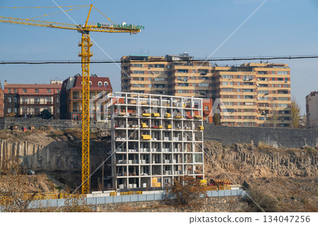 Yerevan Armenia 10.25.2025. A construction site with a crane and a building in the background Yerevan Armenia 10.25.2025. A construction site with a crane and a building in the background 134047256