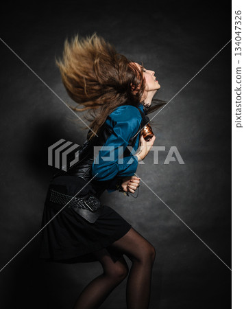 Action shot of an attractive woman swinging her hair. Action shot of an attractive woman swinging her hair. 134047326