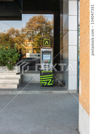Yerevan Armenia 10.25.2025. A green and black ATM machine of Ameria Bank Yerevan Armenia 10.25.2025. A green and black ATM machine of Ameria Bank 134047391