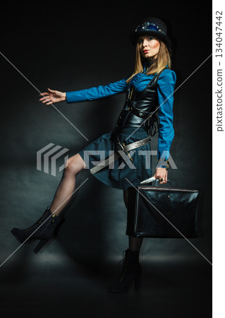 Steampunk girl with retro bag. Steampunk girl with retro bag. 134047442