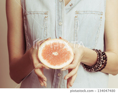 Human holding grapefruit. Healthy diet food. Human holding grapefruit. Healthy diet food. 134047480