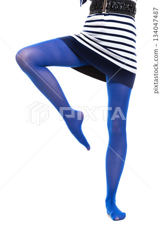 Woman long legs and blue stockings isolated 134047487