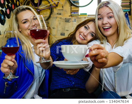 Happy girls in pub club having fun 134047634