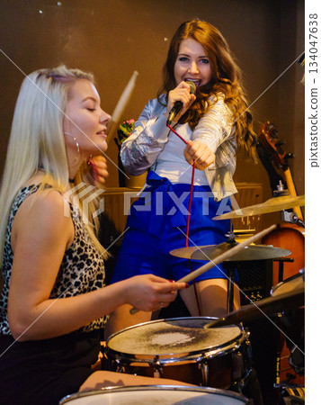 Woman singing, band playing instruments. Woman singing, band playing instruments. 134047638
