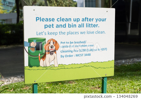 Singapore, Singapore - May 01, 2025: Pet waste management sign with cartoon dog in Orchard Road Singapore, Singapore - May 01, 2025: Pet waste management sign with cartoon dog in Orchard Road 134048269