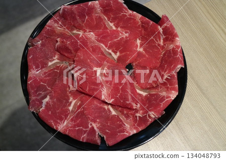 Thinly sliced beef on the plate 134048793