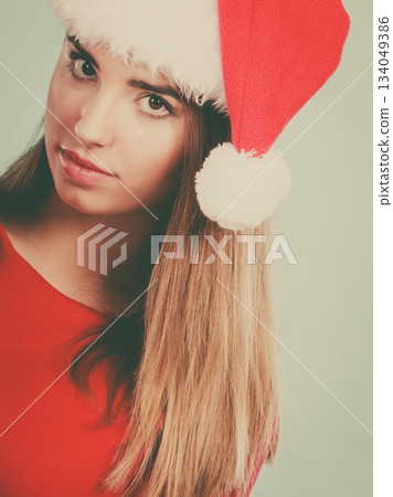 Woman wearing Santa Claus helper costume Woman wearing Santa Claus helper costume 134049386
