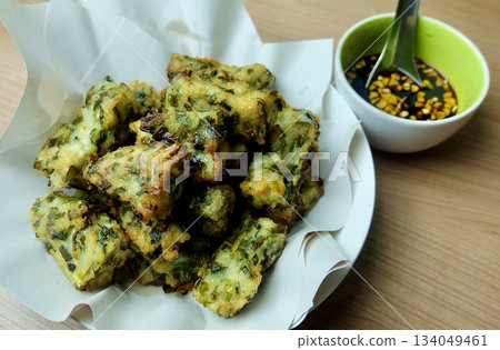 Thai Fried Chive Cakes with Dipping Sauce Thai Fried Chive Cakes with Dipping Sauce 134049461