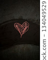 Simple Heart Shape Drawn on a Dark Surface for Valentine's Day Digital Content 134049529