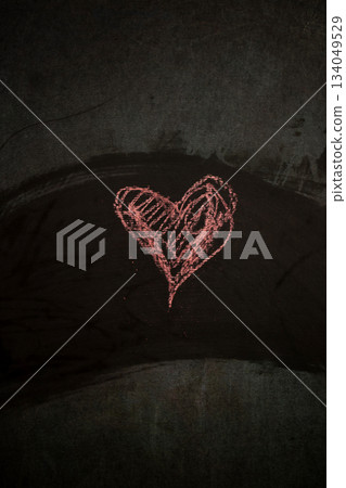 Simple Heart Shape Drawn on a Dark Surface for Valentine's Day Digital Content 134049529