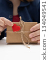 Gift Wrapping for Valentine's Day Showing a Crafted Box and Heart Decoration 134049541