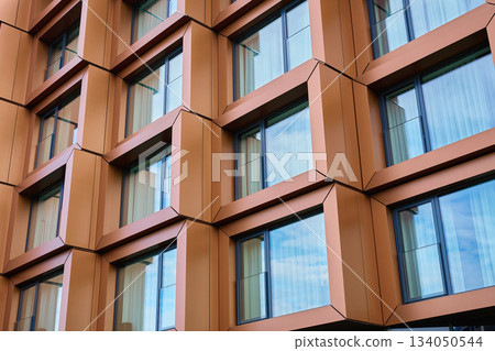 Modern geometric facade with metal window frames 134050544
