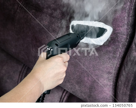 Cleaning fabric couch with steam cleaner for better appearance and hygiene at home Cleaning fabric couch with steam cleaner for better appearance and hygiene at home 134050765