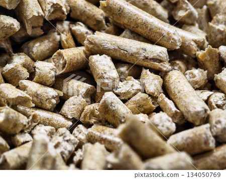Wood pellets made from sawdust stored in a pile for heating and cooking purposes 134050769