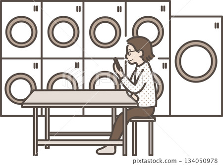 Illustration of a woman in her 40s looking at her smartphone while using a coin laundry Illustration of a woman in her 40s looking at her smartphone while using a coin laundry 134050978