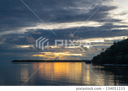 Sunset over the tranquil lagoon of Maupiti, French Polynesia Sunset over the tranquil lagoon of Maupiti, French Polynesia 134051133