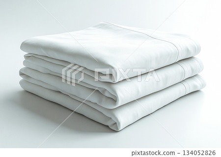 Refined aesthetics. Cotton sheets on a white background. Stack of comfortable white sheets. 134052826