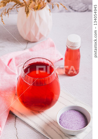 Rapid hydration mix in a glass and bowl on the table vertical view 134054945