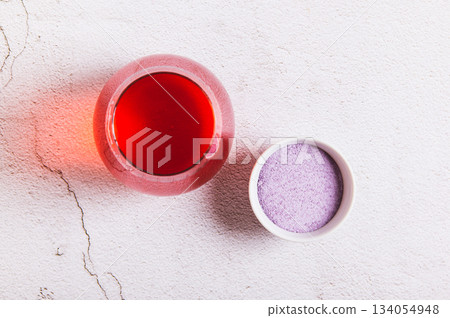 Close up of rapid hydration powder and drink in a glass top view Close up of rapid hydration powder and drink in a glass top view 134054948