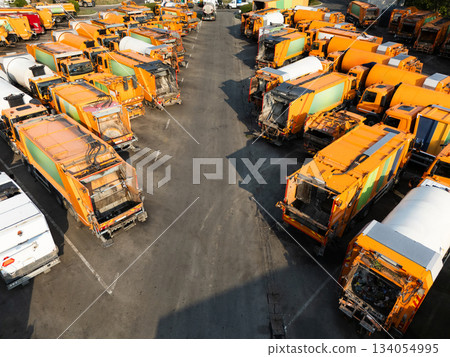 Fleet of yellow garbage trucks. Aerial view Fleet of yellow garbage trucks. Aerial view 134054995
