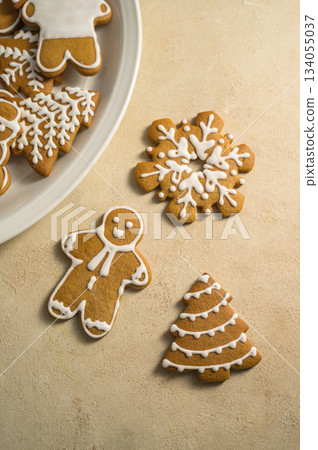 Holiday background. Christmas gingerbread cookies, festive food, home baking. Flat lay Holiday background. Christmas gingerbread cookies, festive food, home baking. Flat lay 134055037