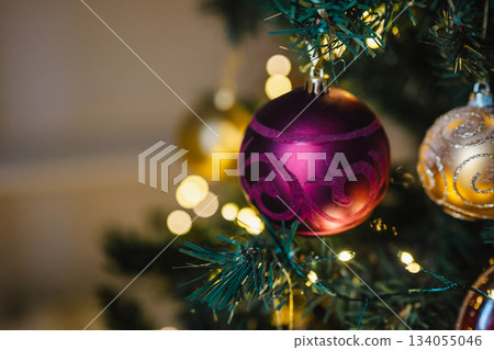 Beautiful Christmas red bauble decoration on Christmas tree, copy space Beautiful Christmas red bauble decoration on Christmas tree, copy space 134055046