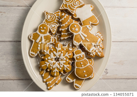 Holiday abstract background. Christmas gingerbread cookies, festive food, home baking. Flat lay Holiday abstract background. Christmas gingerbread cookies, festive food, home baking. Flat lay 134055071