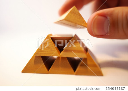 wooden tangram puzzle in play arrow shape wooden tangram puzzle in play arrow shape 134055187