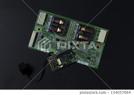 Computer parts and board on a black background Computer parts and board on a black background 134057064