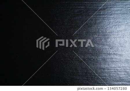 Texture of black ceramic plate with horizontal stripes 134057280
