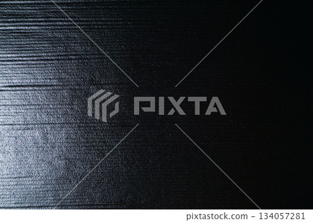 Texture of black ceramic plate with horizontal stripes 134057281
