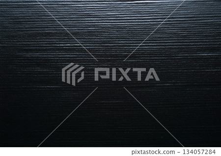 Texture of black ceramic plate with horizontal stripes 134057284
